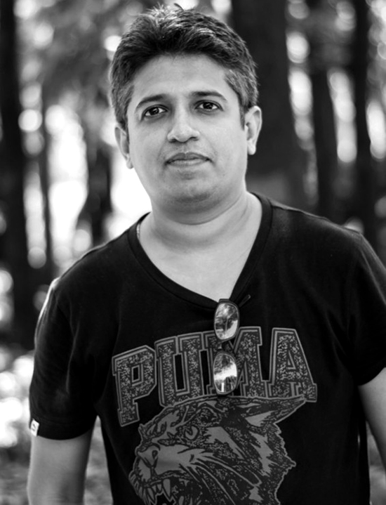 Black and white headshot of Ashish Shah.