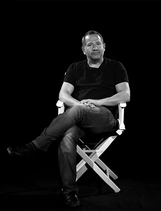 Man sitting on a film director chair